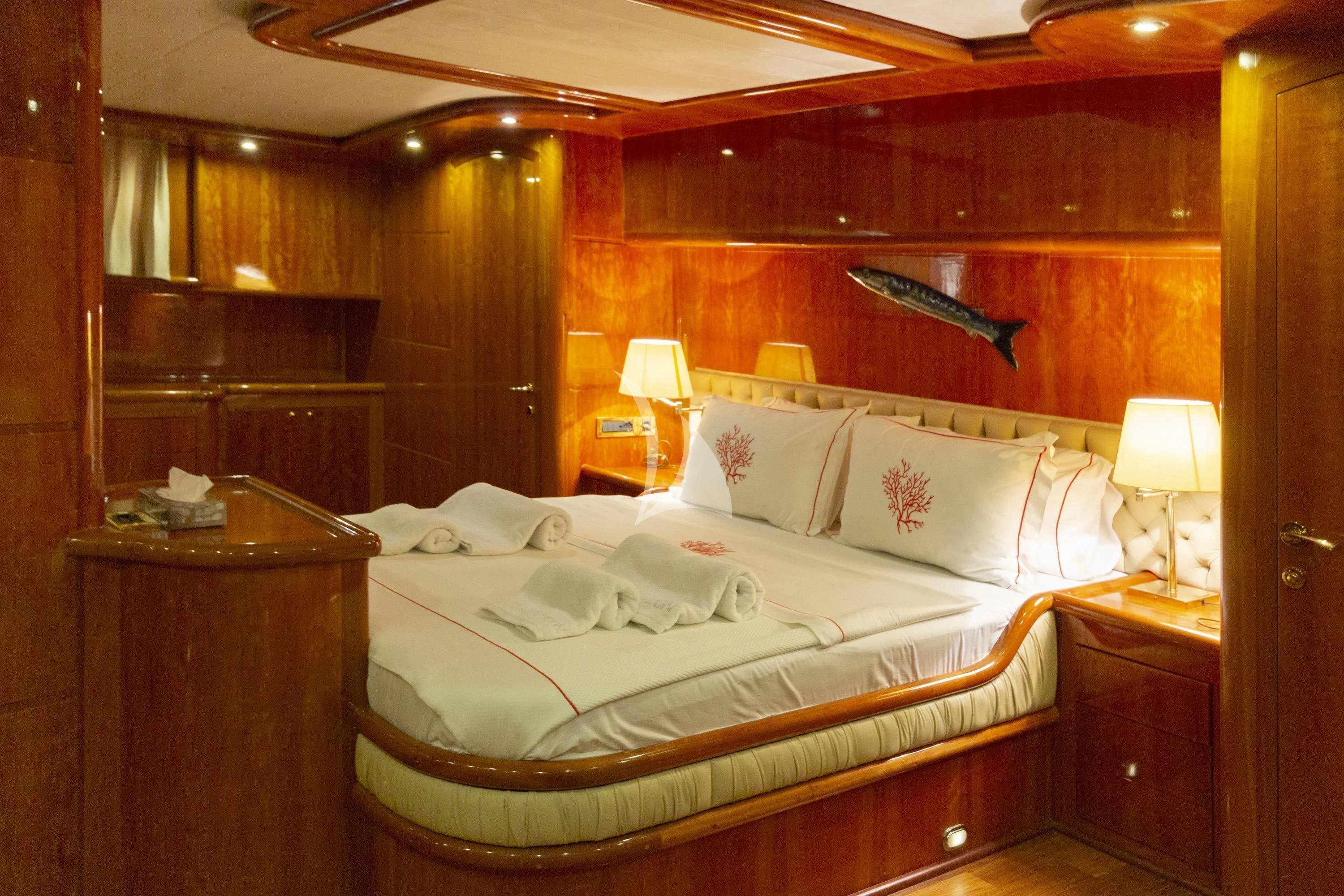 a bed with a white sheet and pillows aboard SILVER MOON Yacht for Sale