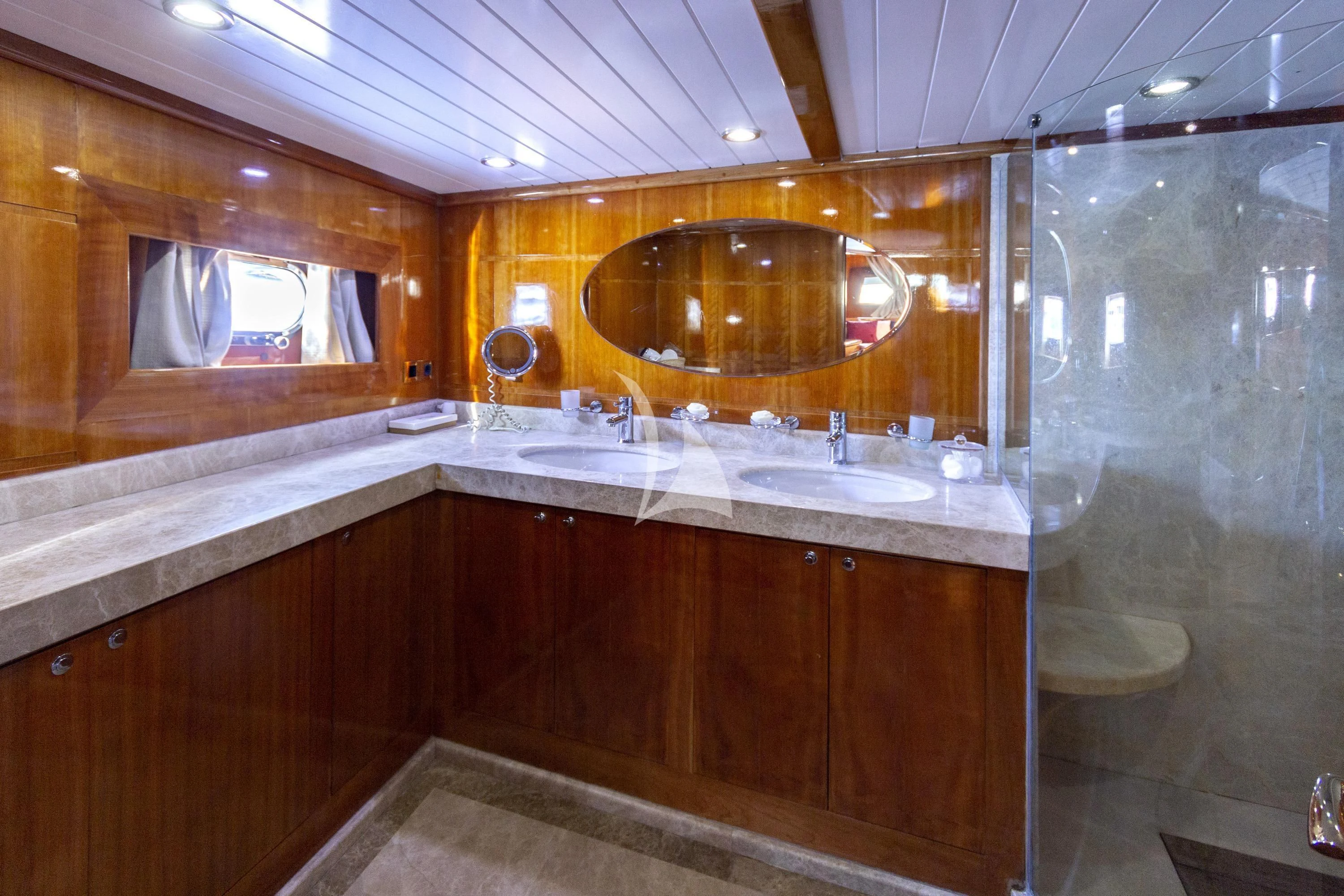 a bathroom with a large mirror aboard SILVER MOON Yacht for Sale