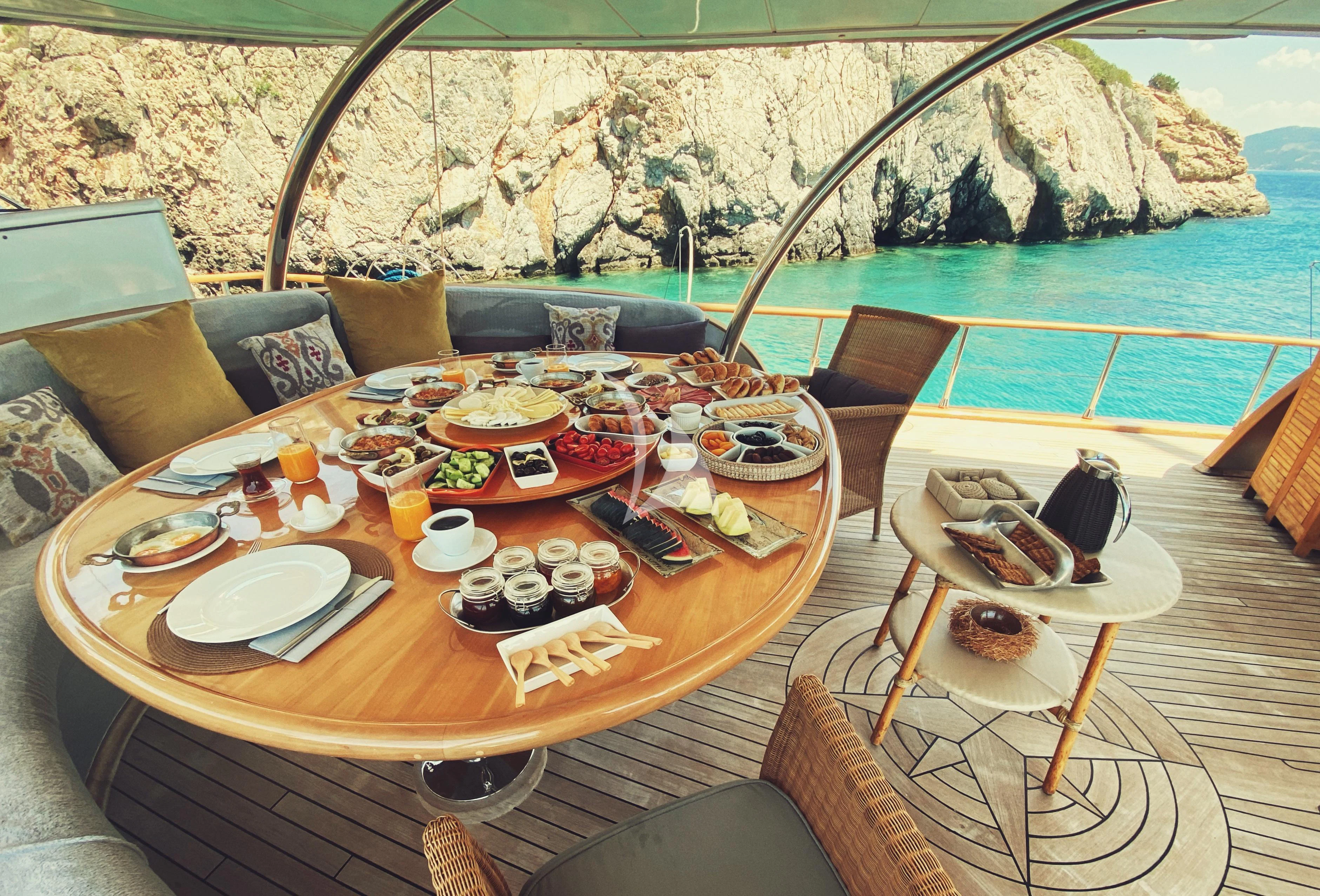 a table with food on it aboard SILVER MOON Yacht for Sale