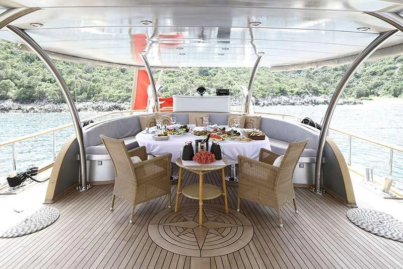 a table on a deck aboard SILVER MOON Yacht for Sale