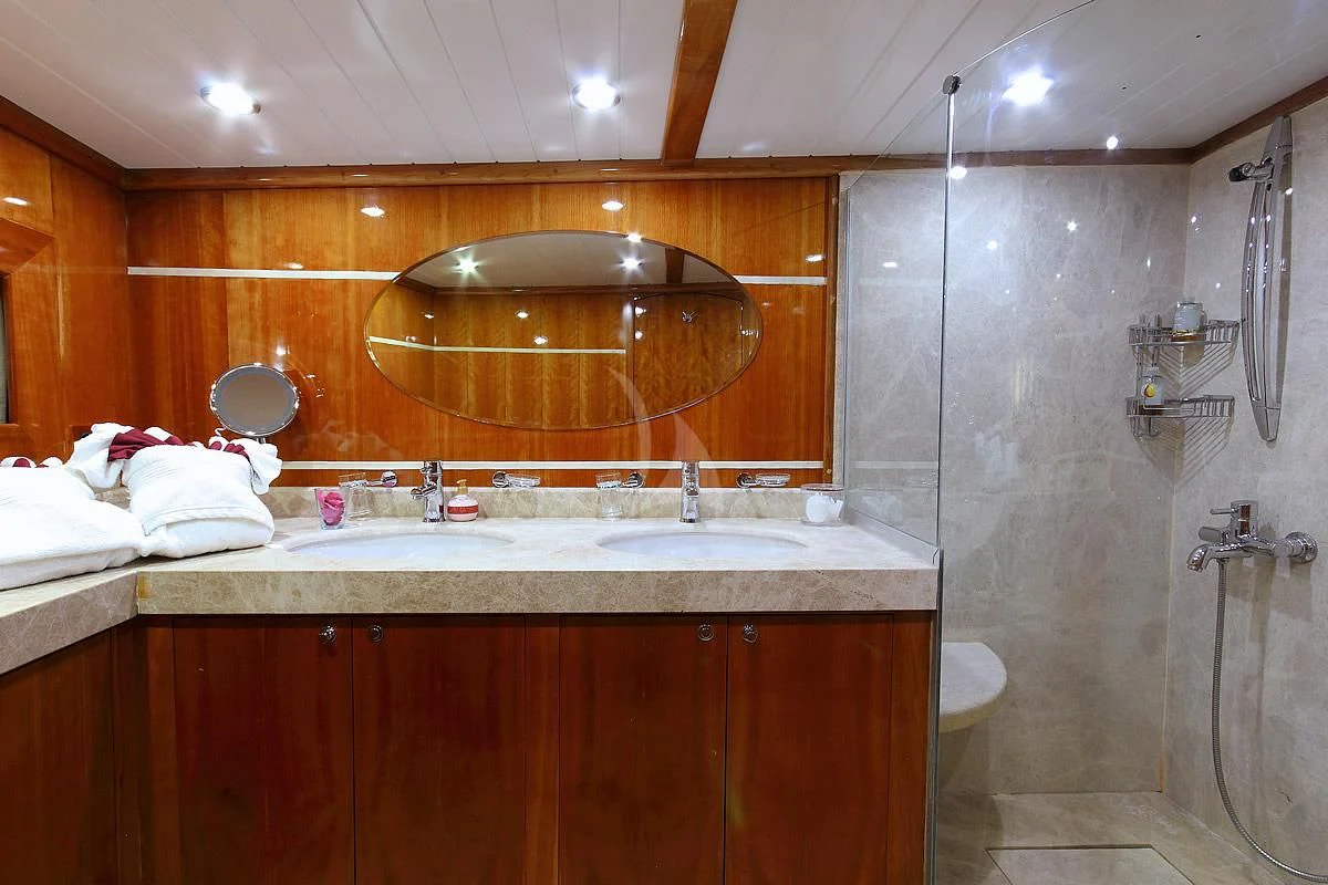 a bathroom with a large mirror aboard SILVER MOON Yacht for Sale