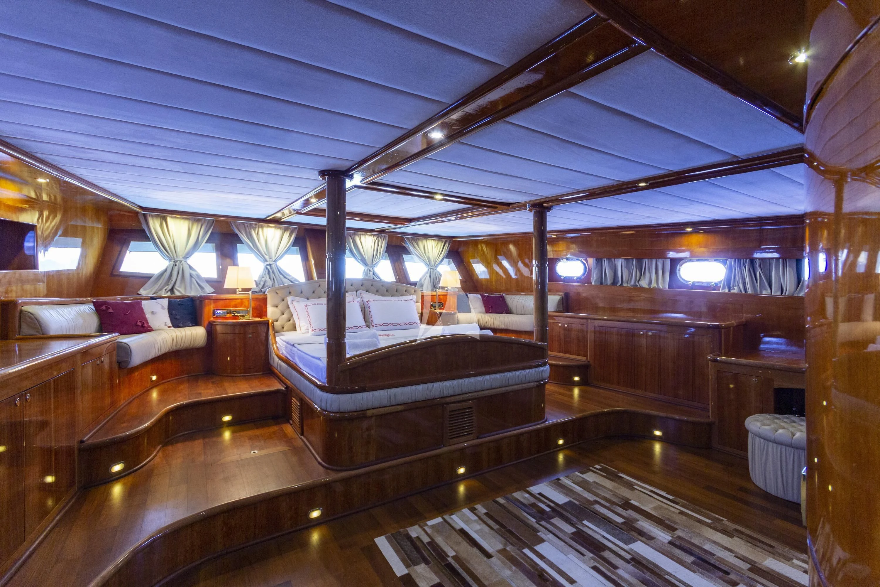 a room with a bed and a couch aboard SILVER MOON Yacht for Sale