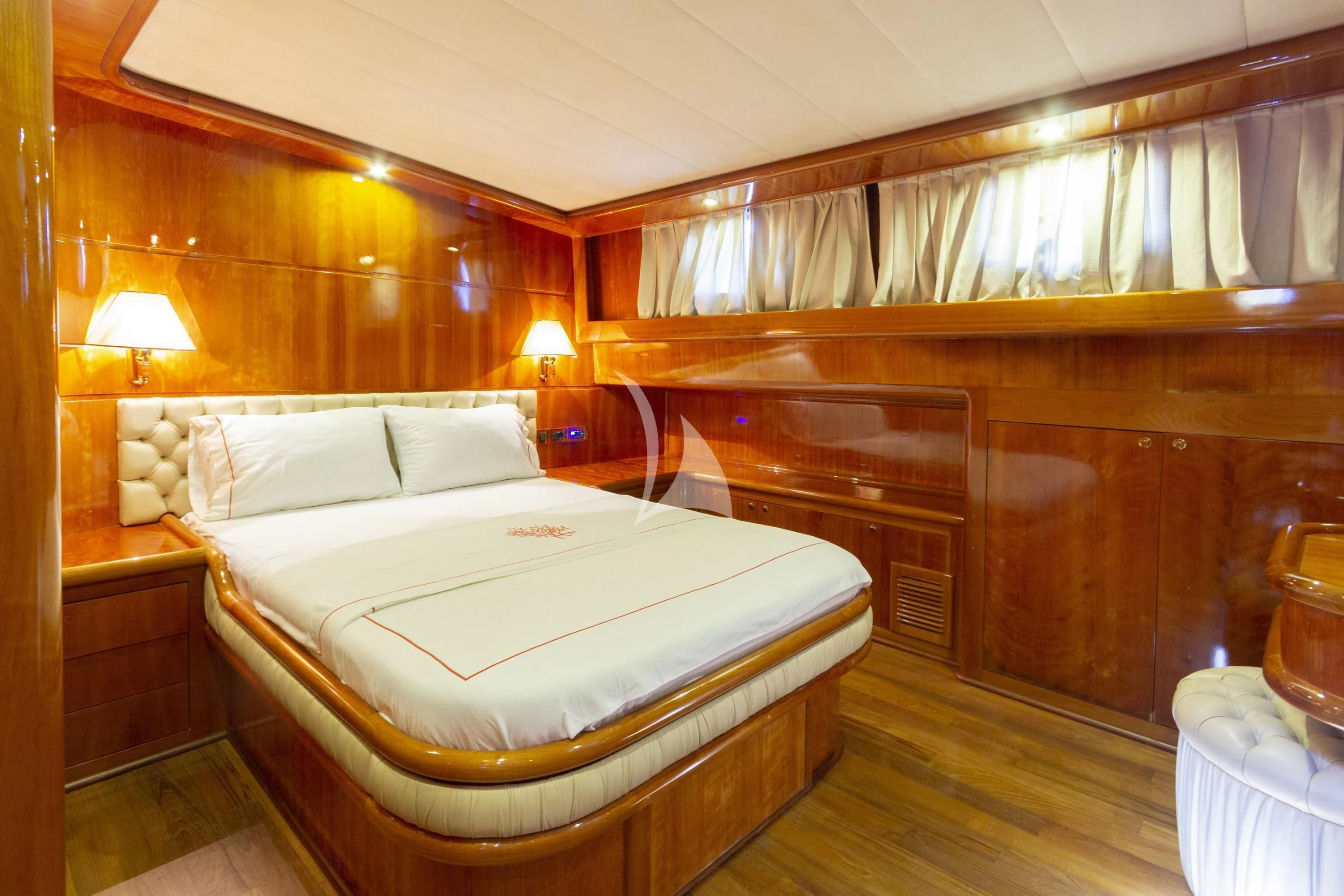 a bedroom with a bed and a wood wall aboard SILVER MOON Yacht for Sale