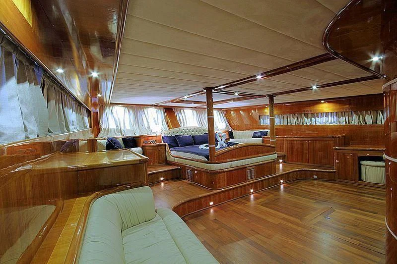 a room with wood floors and a couch and a wood floor aboard SILVER MOON Yacht for Sale