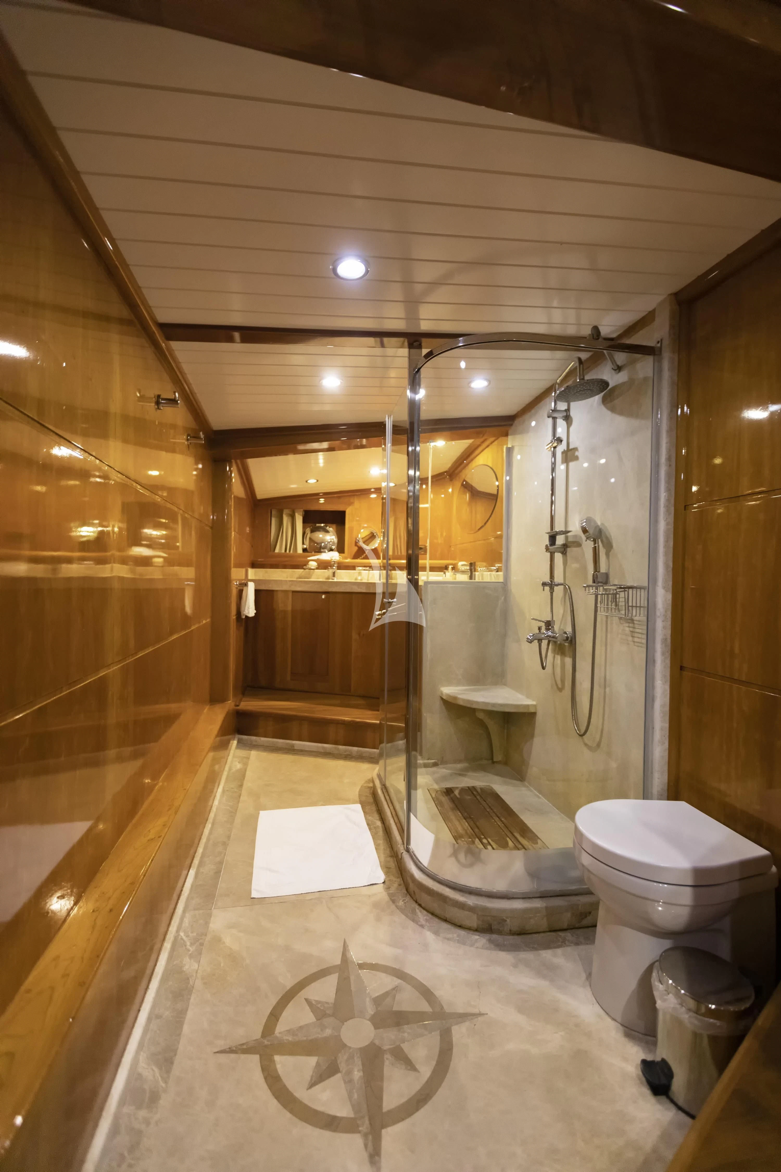 a bathroom with a glass shower aboard SILVER MOON Yacht for Sale