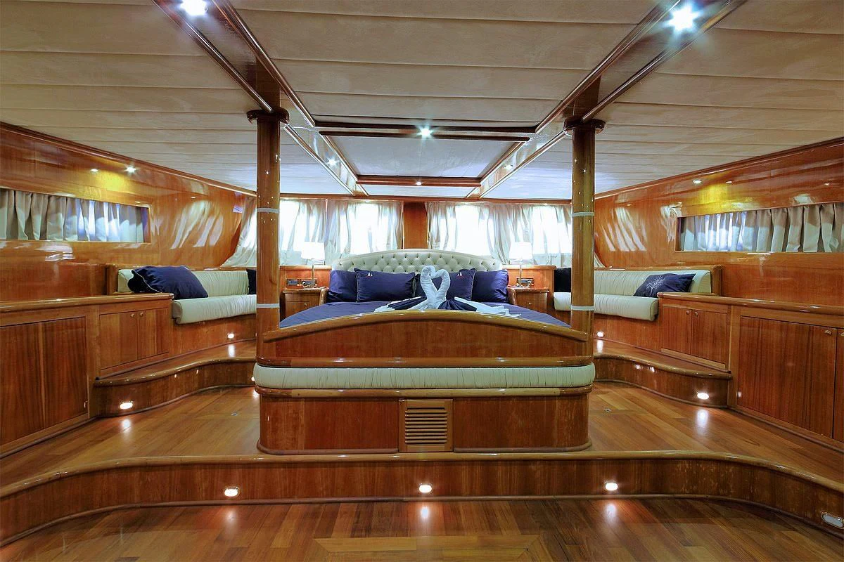 a room with a wood floor and a couch and a wood floor aboard SILVER MOON Yacht for Sale