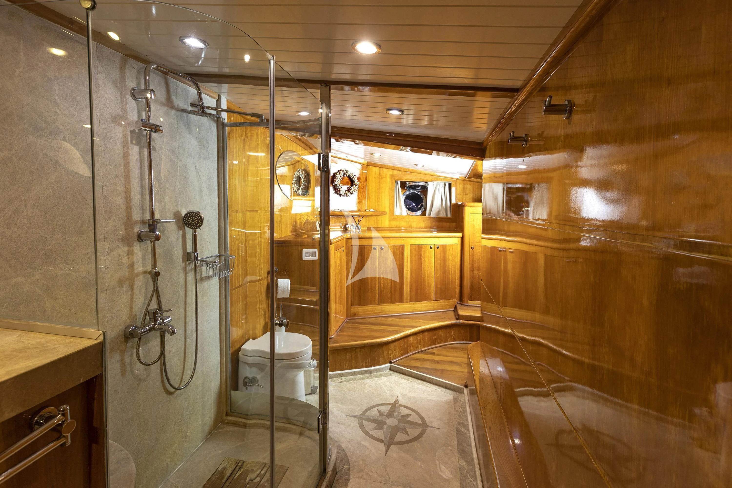 a bathroom with a glass shower aboard SILVER MOON Yacht for Sale