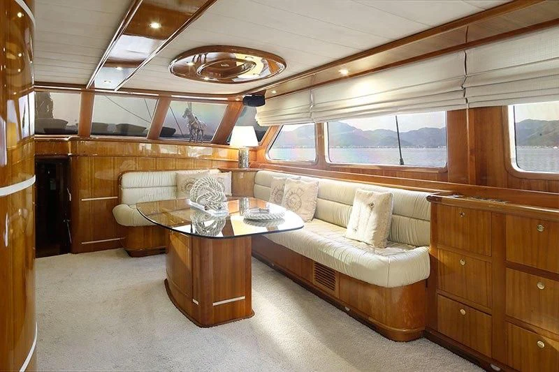 a living room with a couch and a coffee table aboard SILVER MOON Yacht for Sale