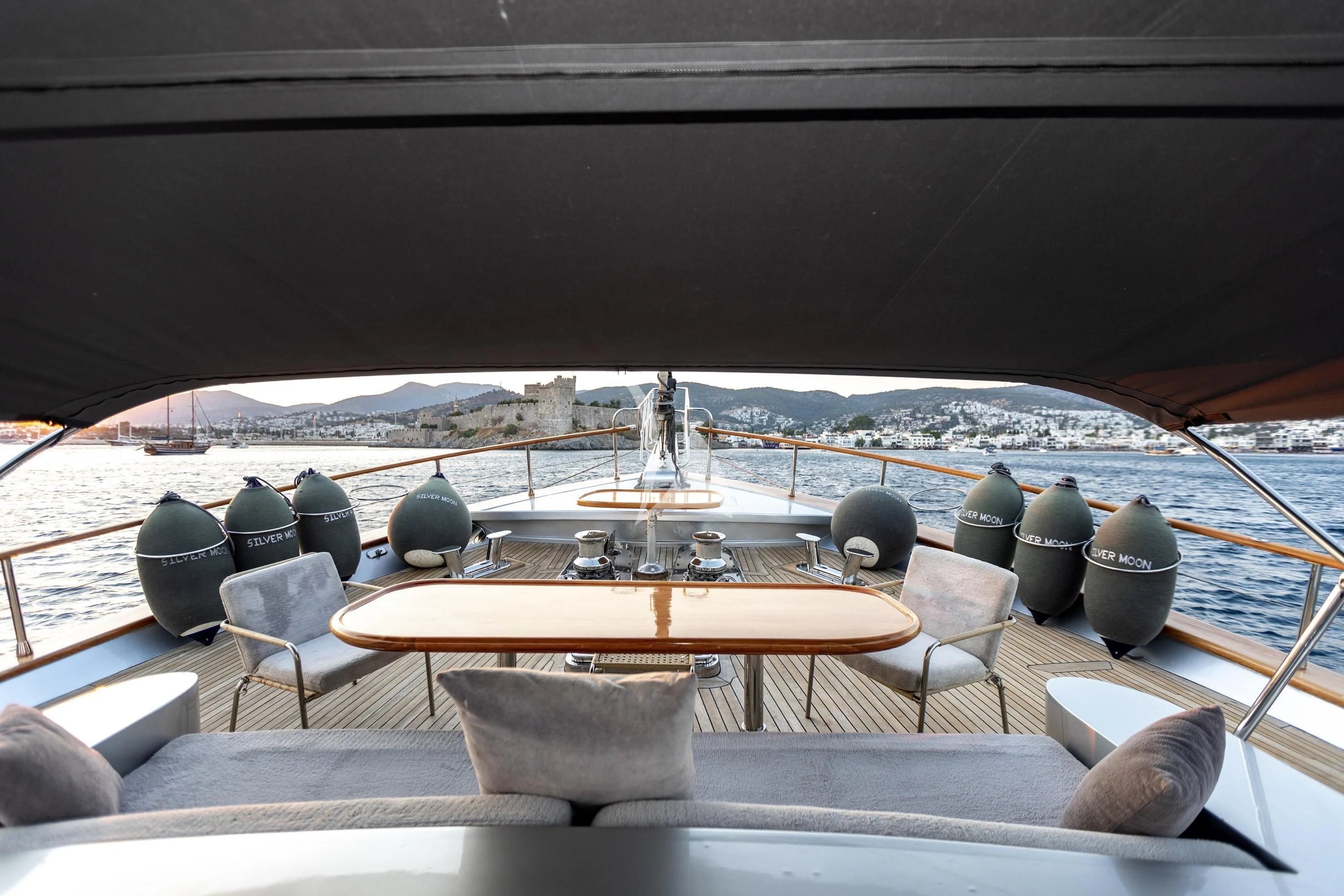 a room with a table and chairs aboard SILVER MOON Yacht for Sale