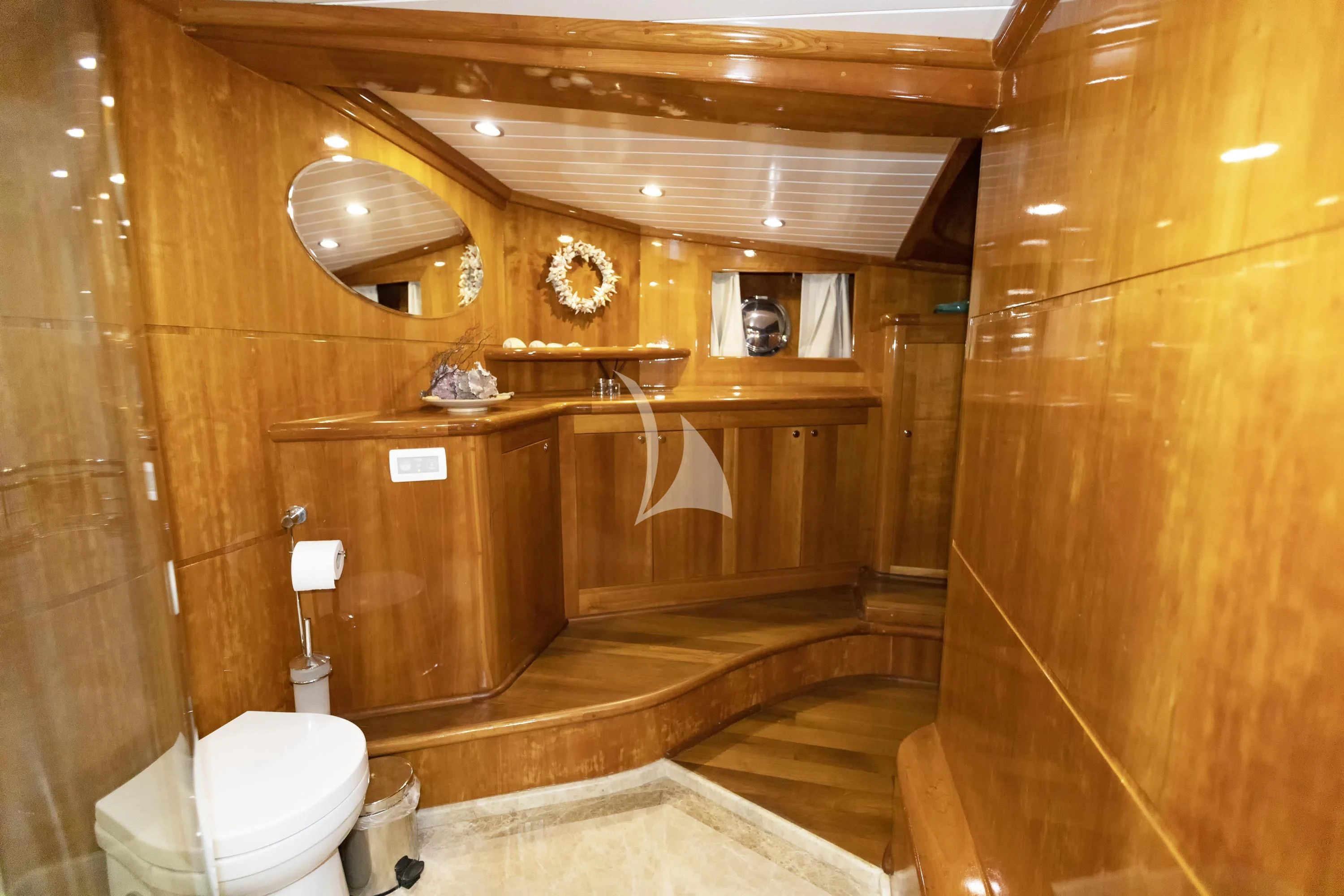 a bathroom with wood walls aboard SILVER MOON Yacht for Sale