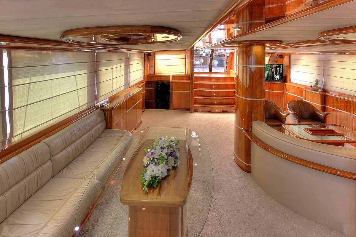 a room with a table and chairs aboard SILVER MOON Yacht for Sale