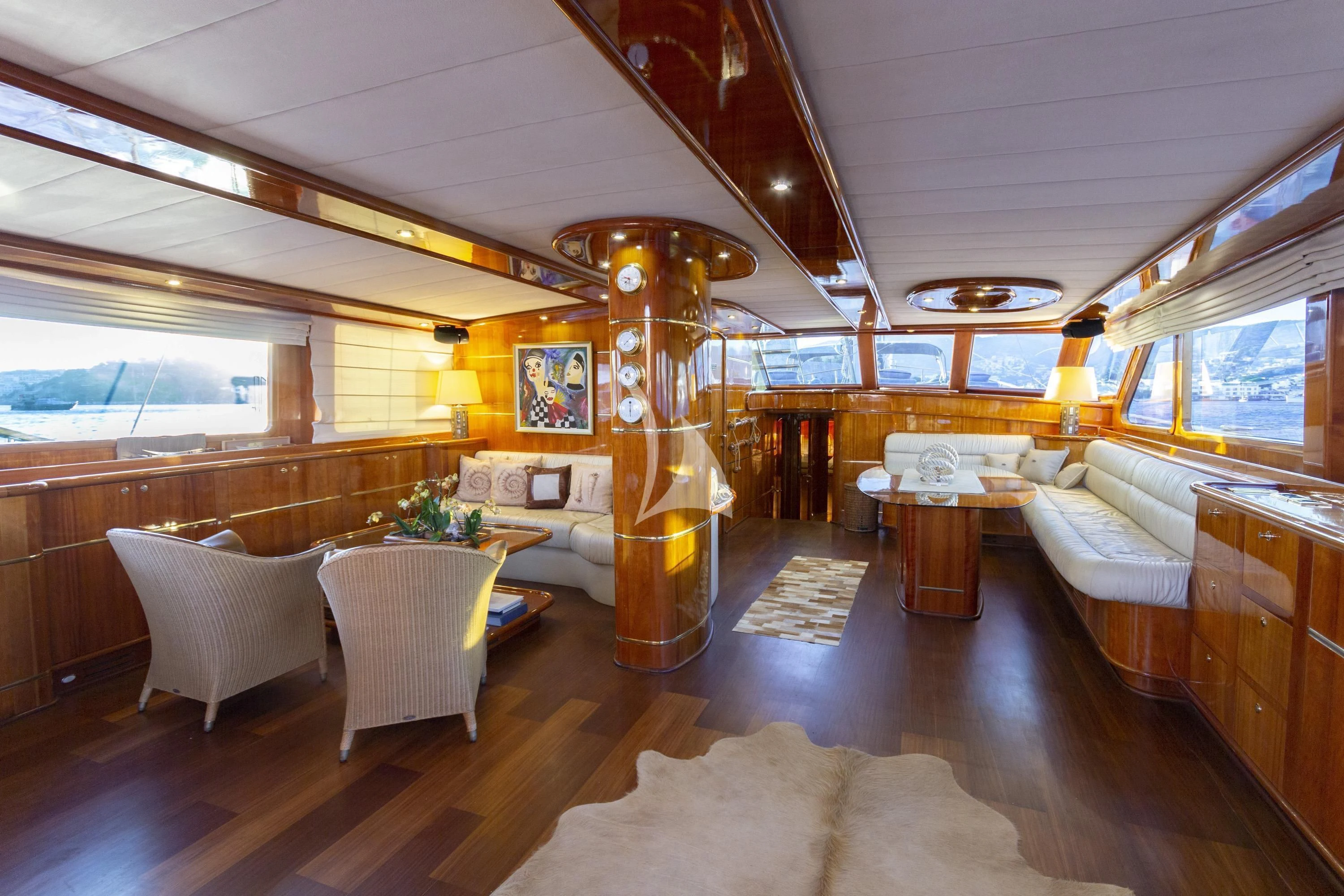 a large room with a chandelier and a couch aboard SILVER MOON Yacht for Sale