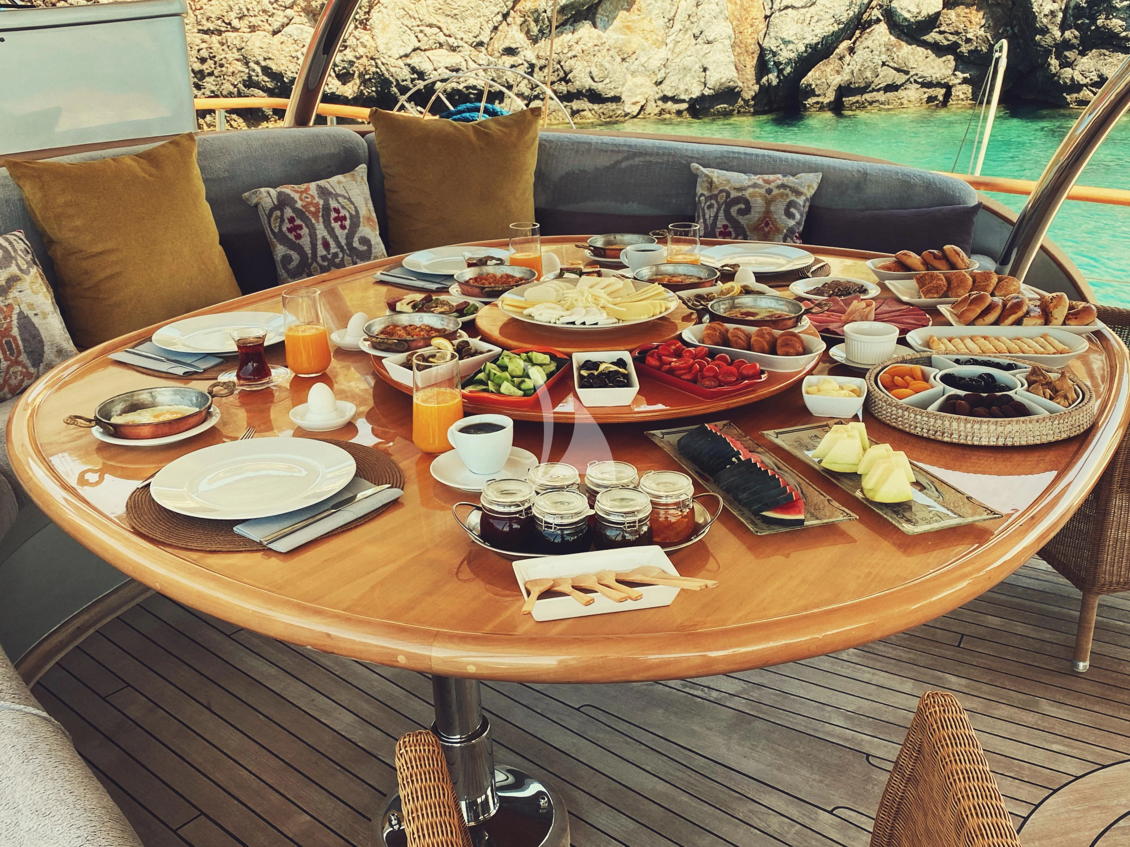 a table with food on it aboard SILVER MOON Yacht for Sale