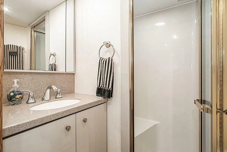 a bathroom with a sink and a mirror aboard ECHOES Yacht for Sale
