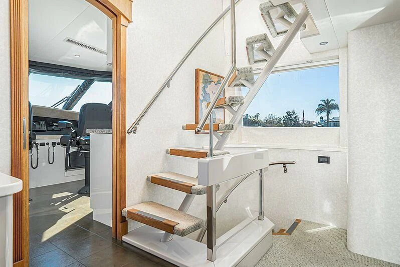a white bench sits in a room aboard ECHOES Yacht for Sale