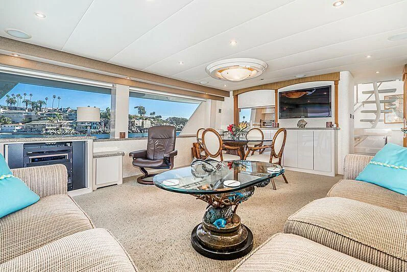 a living room with a table and chairs aboard ECHOES Yacht for Sale