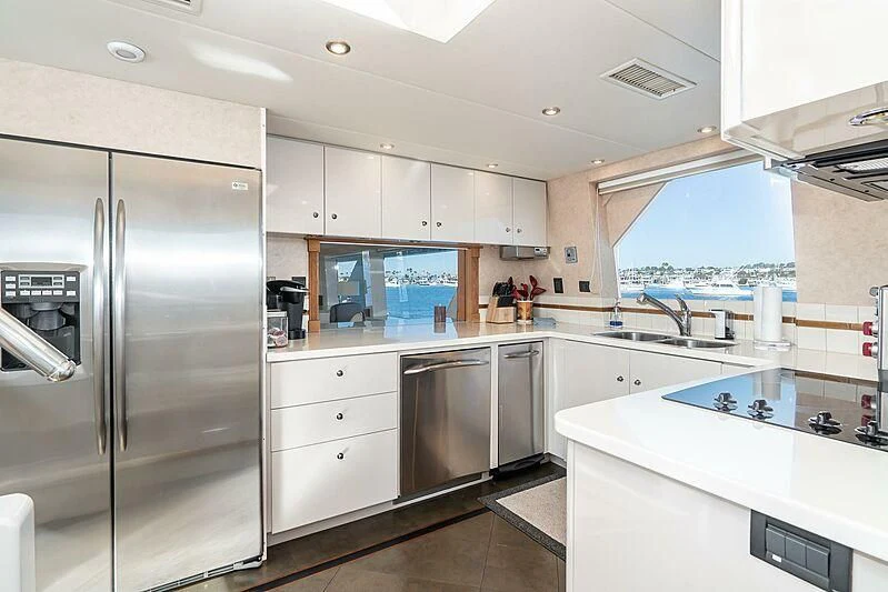 a kitchen with a large refrigerator aboard ECHOES Yacht for Sale