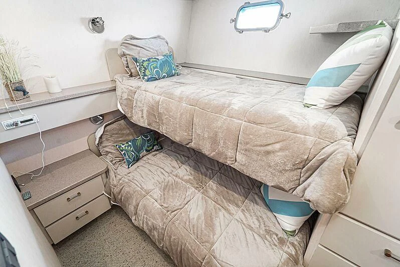 a bed with a blanket aboard ECHOES Yacht for Sale