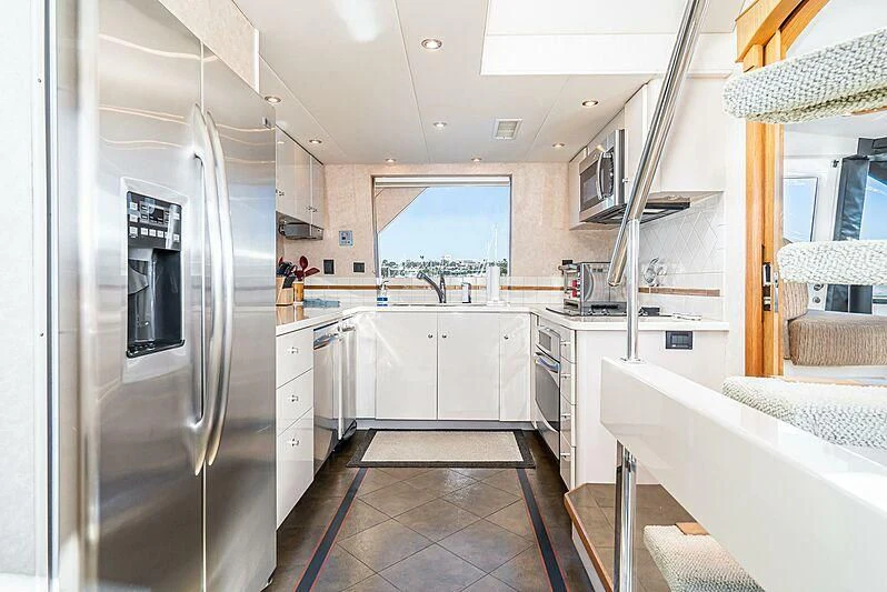 a kitchen with a large refrigerator aboard ECHOES Yacht for Sale