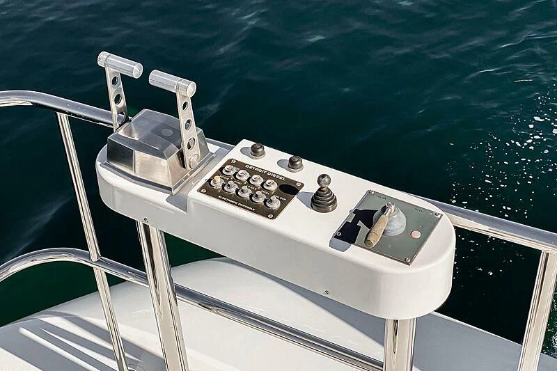 a white machine with buttons and a remote control on it aboard ECHOES Yacht for Sale