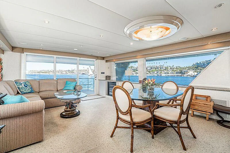 a living room with a table and chairs aboard ECHOES Yacht for Sale