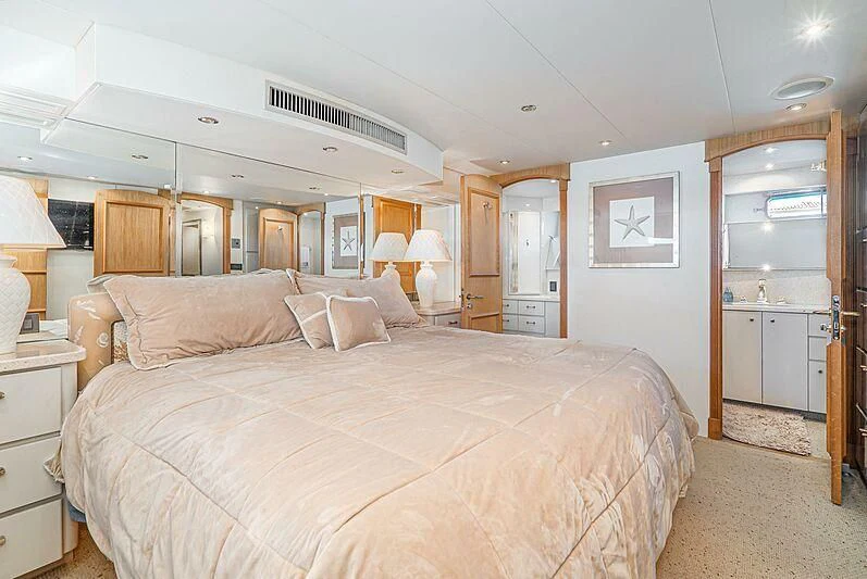 a large bed in a bedroom aboard ECHOES Yacht for Sale