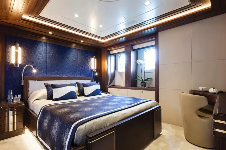 a bedroom with a large bed aboard JULIA Yacht for Sale
