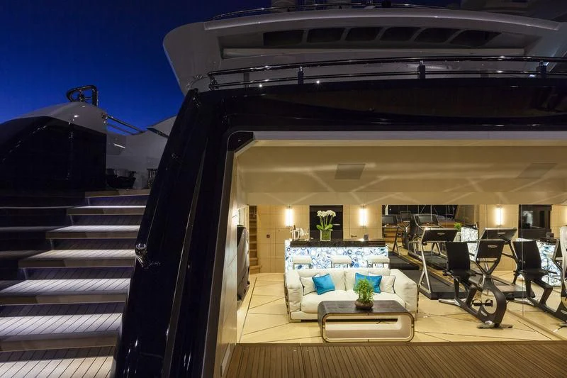 a room with a table and chairs aboard JULIA Yacht for Sale