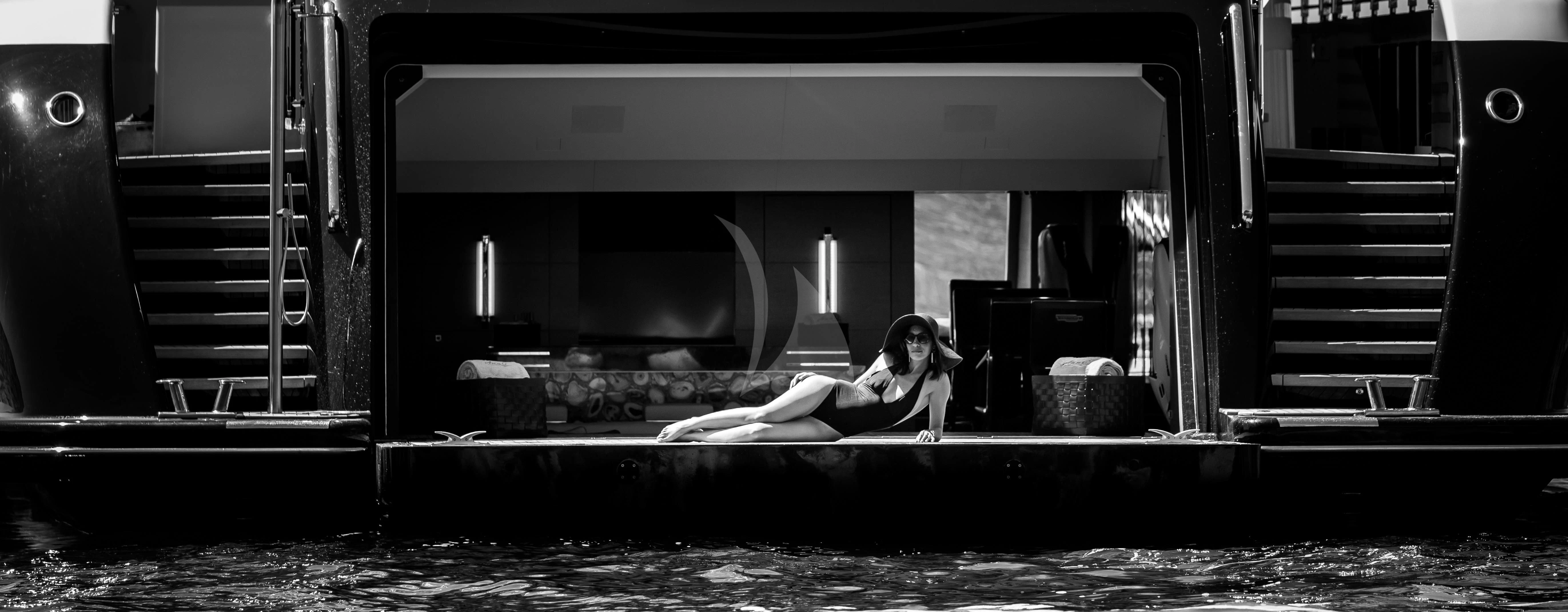 a person sitting on a couch aboard JULIA Yacht for Sale