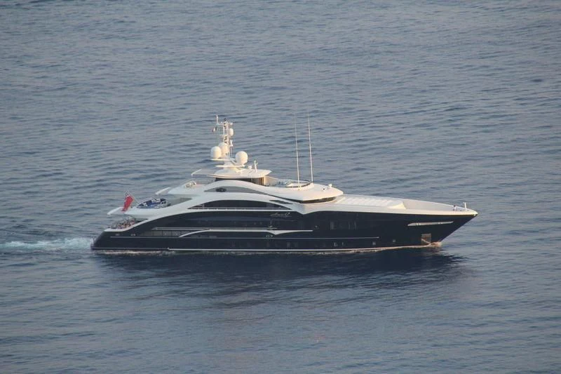 a large ship in the water aboard JULIA Yacht for Sale