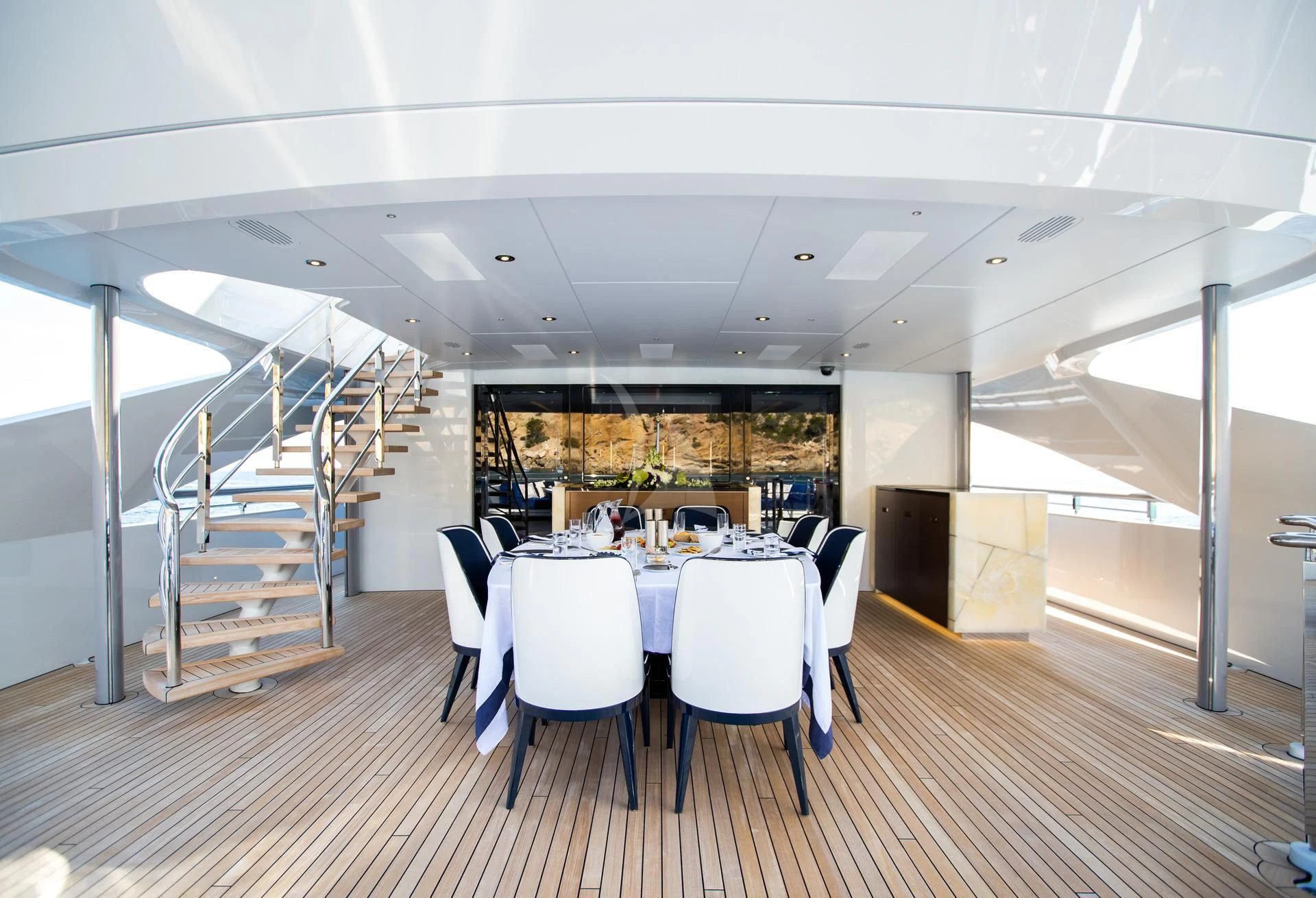 a large room with a table and chairs aboard JULIA Yacht for Sale