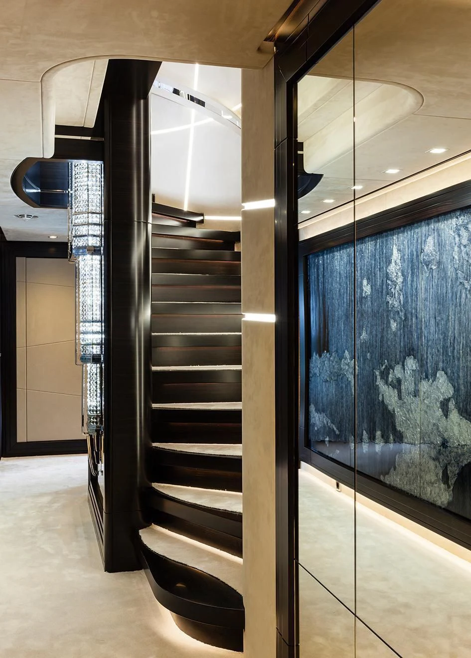 a black staircase in a room aboard JULIA Yacht for Sale