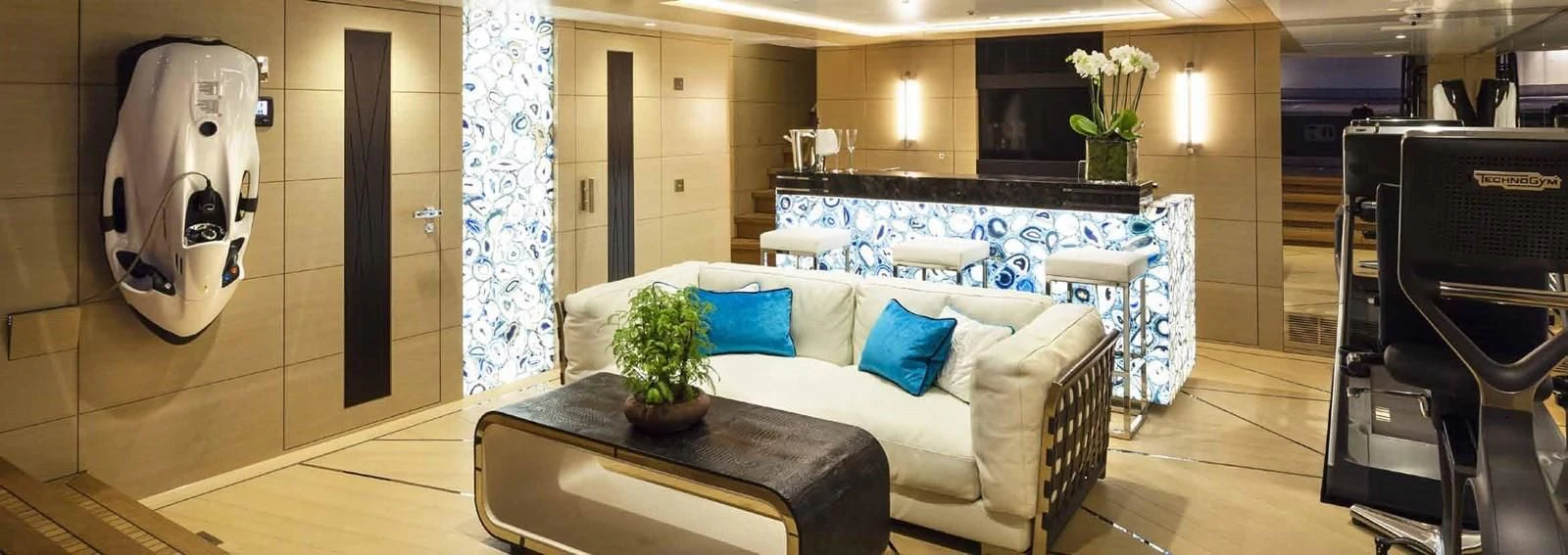 a room with a couch and a table aboard JULIA Yacht for Sale