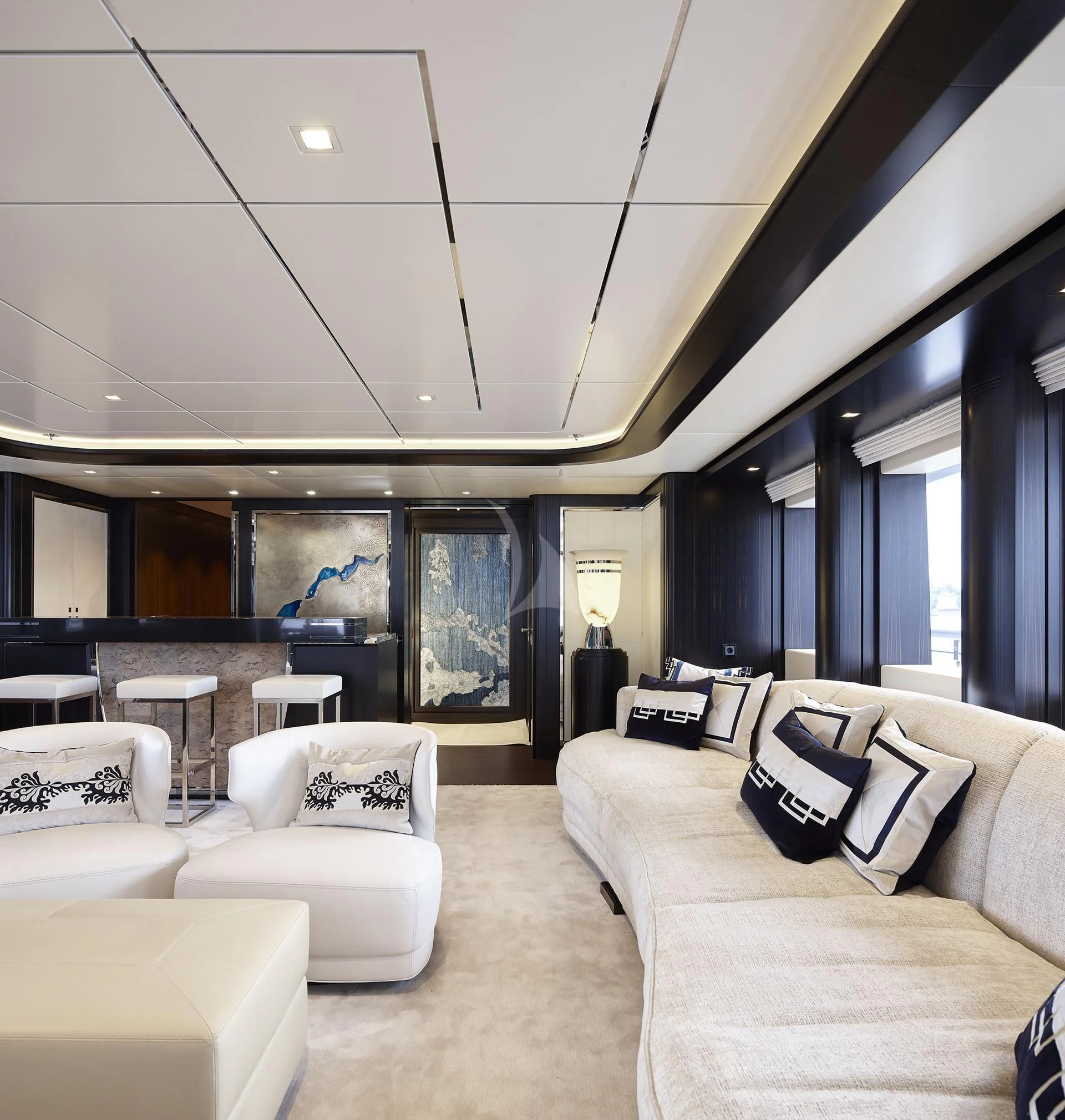 a room with couches and a table aboard JULIA Yacht for Sale