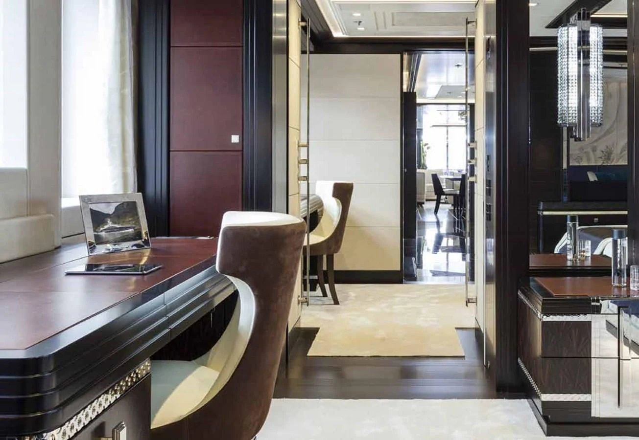 a room with a table and chairs aboard JULIA Yacht for Sale