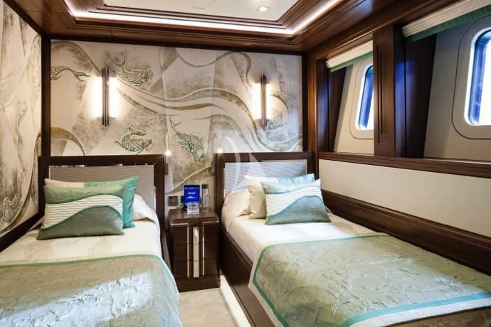a couple of beds in a room aboard JULIA Yacht for Sale