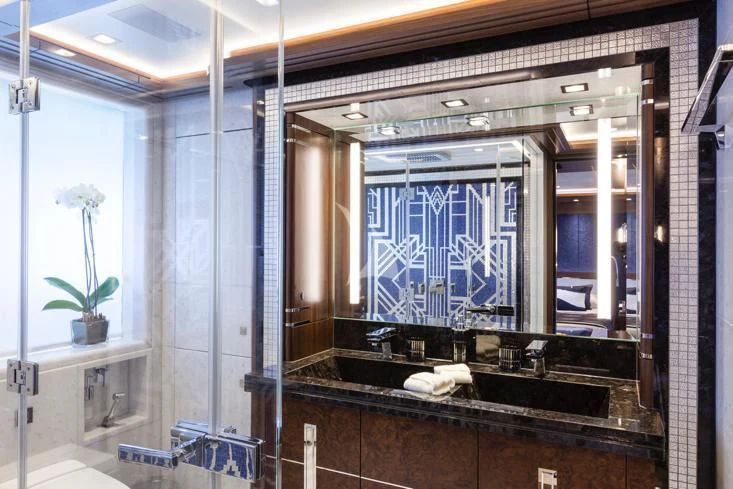 a bathroom with a large mirror aboard JULIA Yacht for Sale