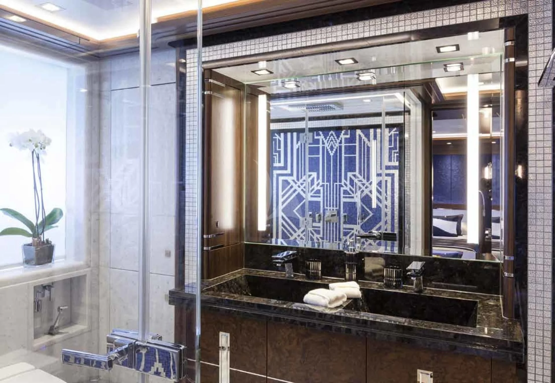 a bathroom with a large mirror aboard JULIA Yacht for Sale