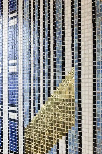 a tall building with a large glass window aboard JULIA Yacht for Sale