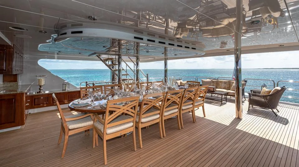 a room with a table and chairs aboard SILVER LINING Yacht for Sale