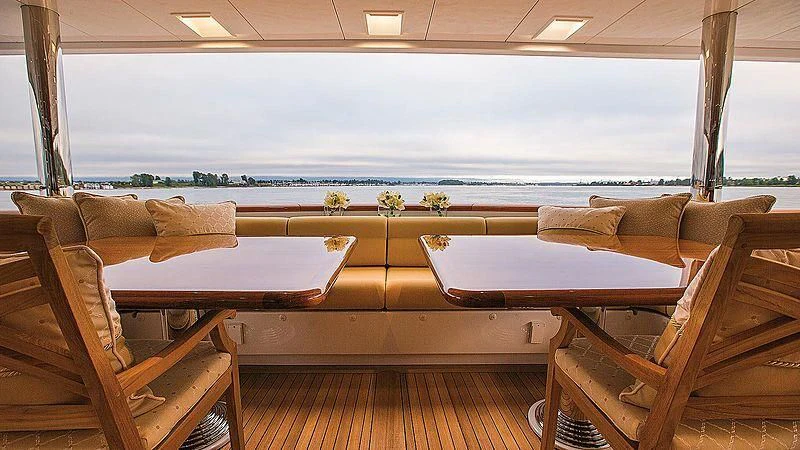a room with couches and chairs aboard SILVER LINING Yacht for Sale