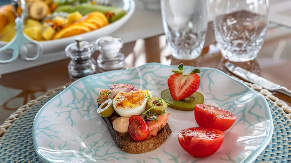 a plate of food aboard SILVER LINING Yacht for Sale