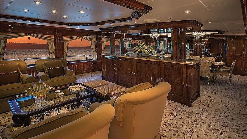 a room with a table chairs and a large window aboard SILVER LINING Yacht for Sale