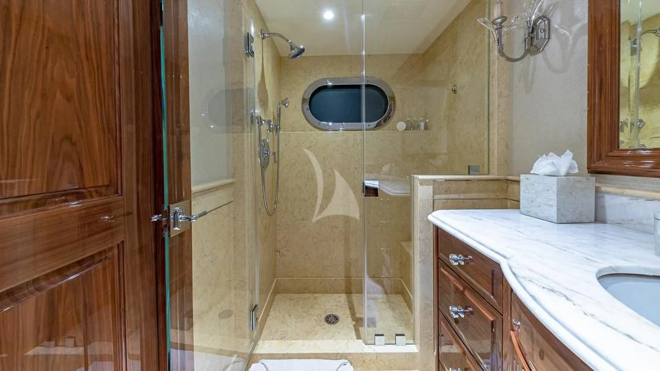 a bathroom with a shower unit and sink aboard SILVER LINING Yacht for Sale