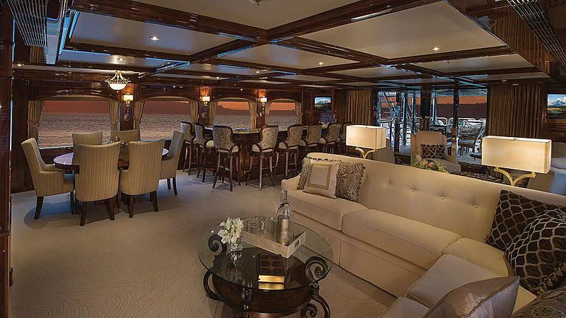 a living room with a couch and a table aboard SILVER LINING Yacht for Sale