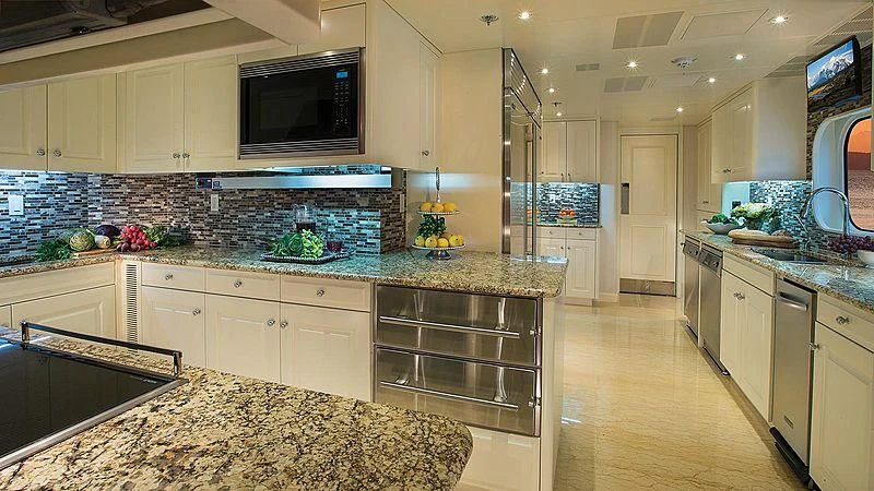 a kitchen with marble counters aboard SILVER LINING Yacht for Sale