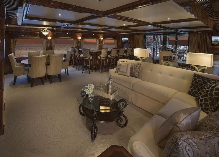 a large room with a table and chairs aboard SILVER LINING Yacht for Sale