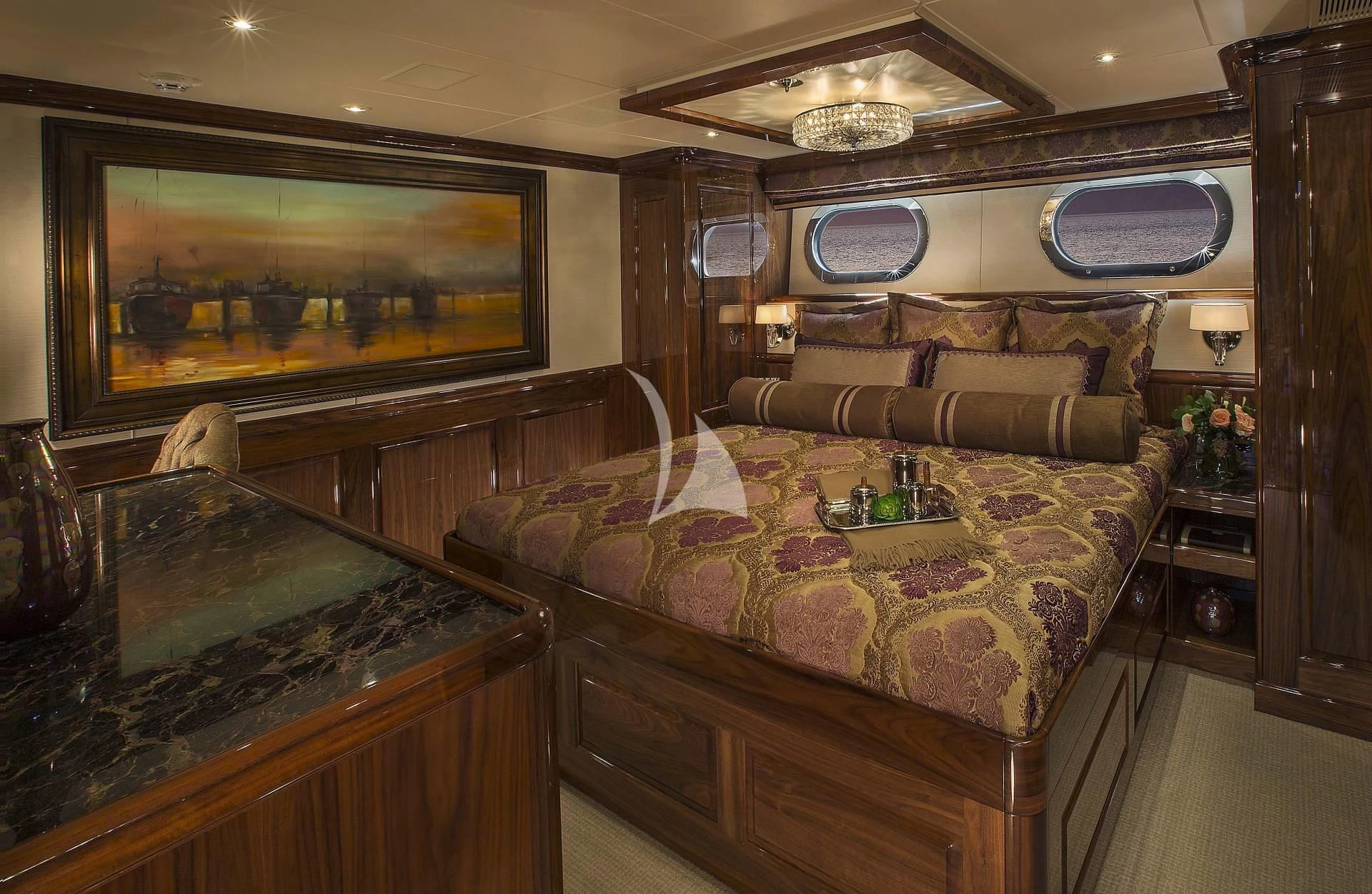 a large living room with a large bed and a large mirror aboard SILVER LINING Yacht for Sale