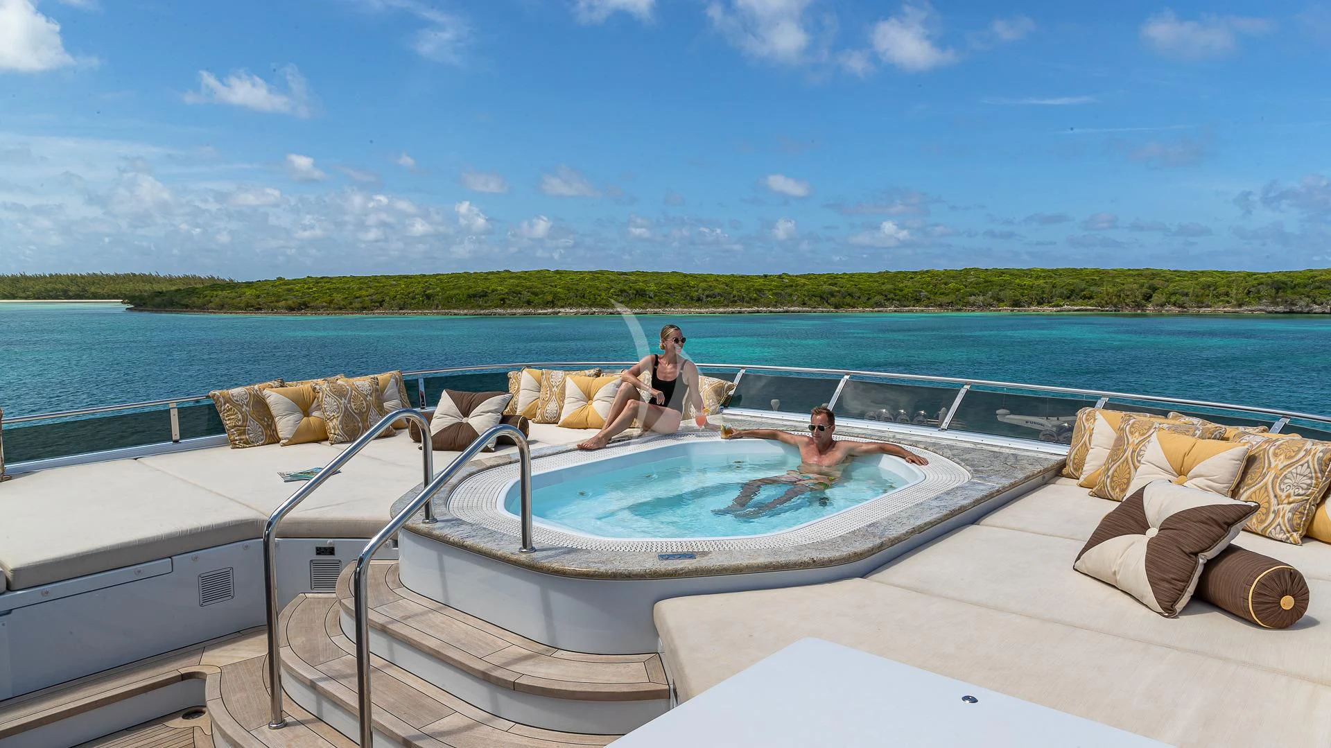 a man and a woman in a boat on a lake aboard SILVER LINING Yacht for Sale