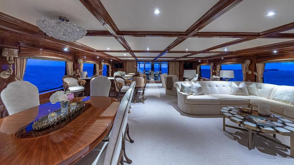 a room with a large table and chairs aboard SILVER LINING Yacht for Sale